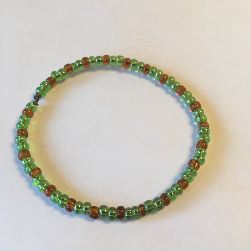 Green and gold glass beaded bracelet